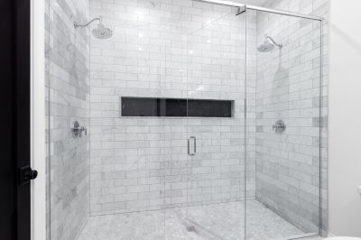 Marble-Style Tiles and Frameless Glass